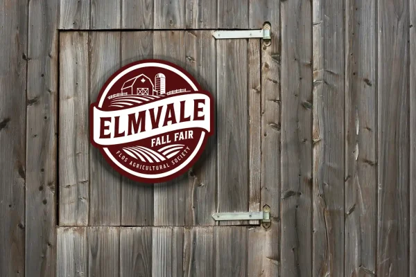 New Flos Agricultural Society and Elmvale Fall Fair logo displayed on a barn door