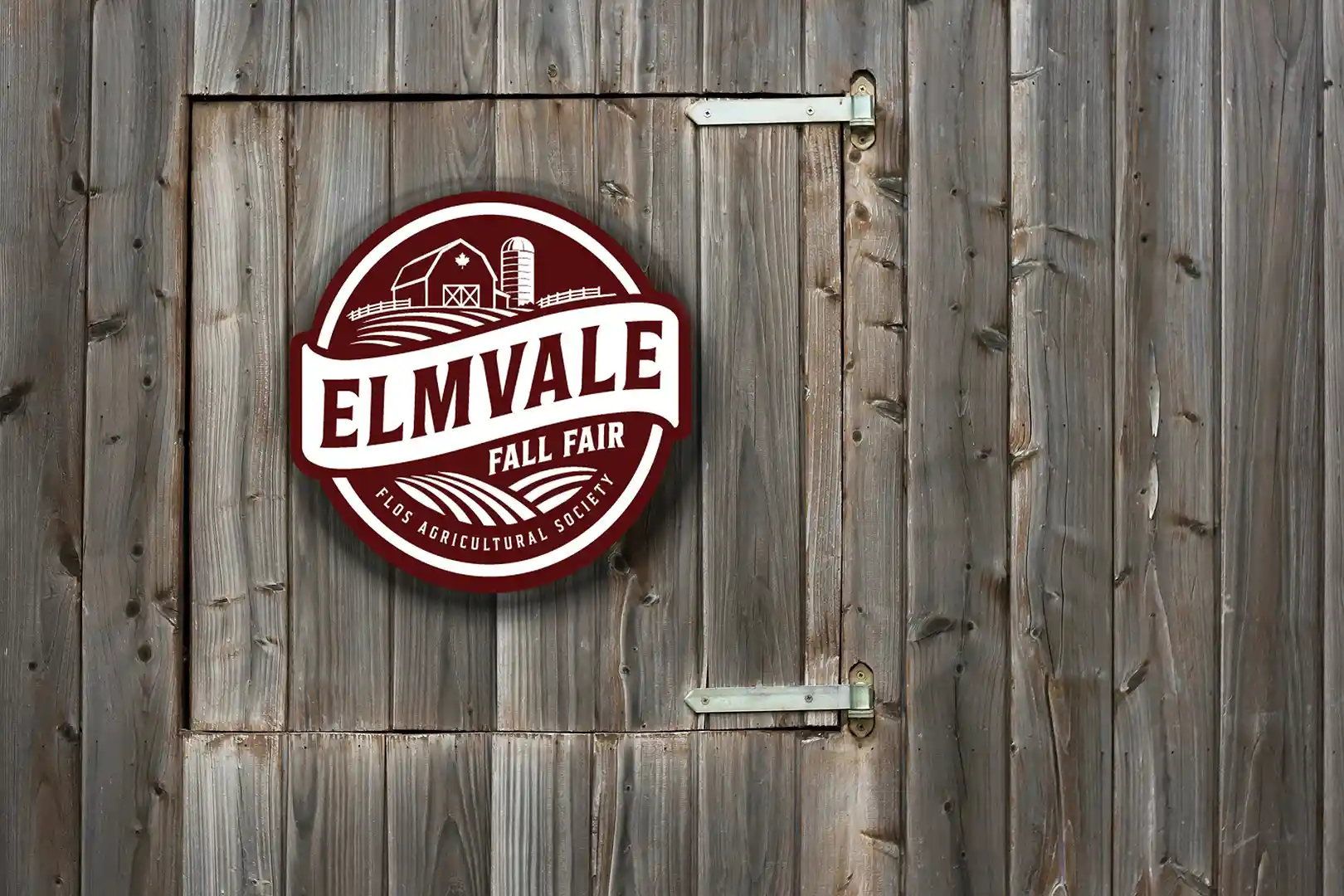 New Flos Agricultural Society and Elmvale Fall Fair logo displayed on a barn door