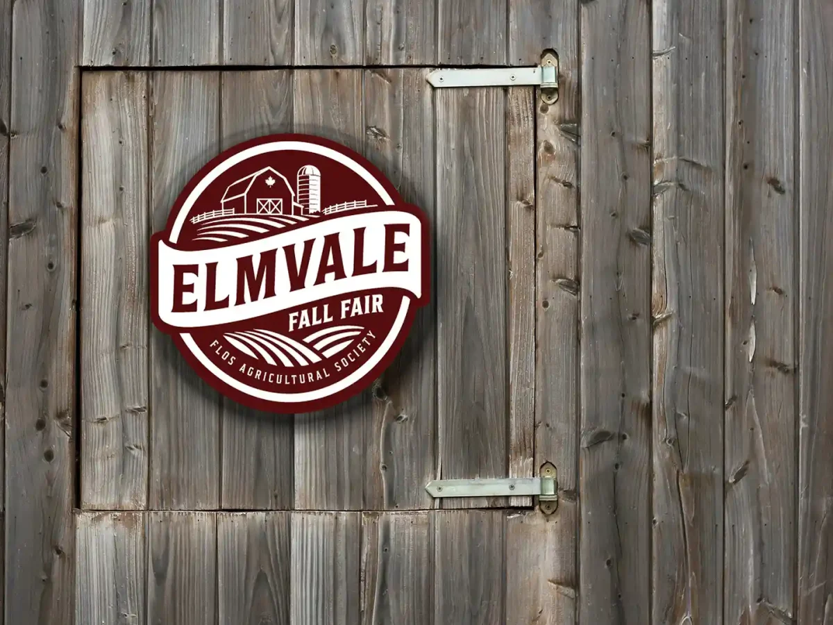 New Flos Agricultural Society and Elmvale Fall Fair logo displayed on a barn door
